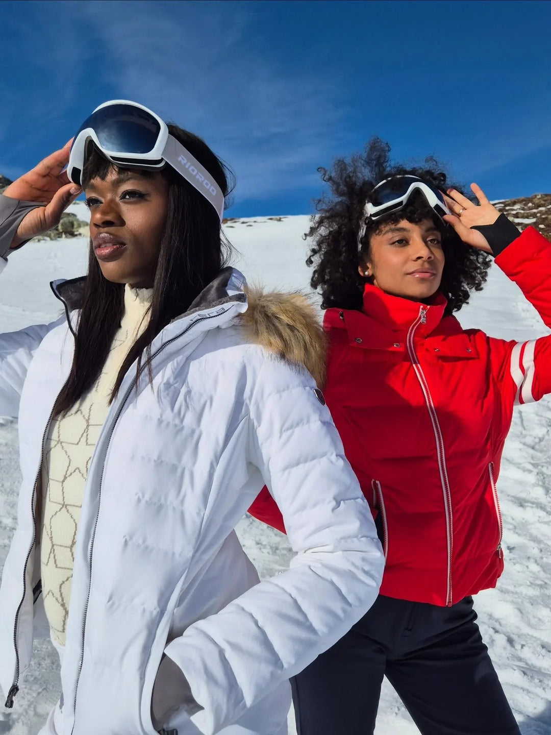 Women wearing the Kate Parka and Julia Parka ski jackets, made with a 10K/10K waterproof, breathable laminate.